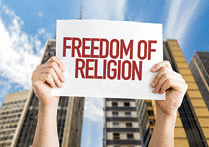 a sign showing FREEDOM OF RELIGION