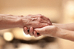 Female hands touching old male hand - taking care of the elderly concept