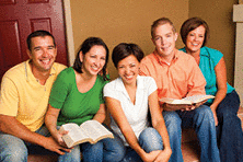 A multicultural small group in a Bible study.