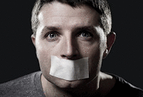 A young man with mouth and lips sealed with tape to prevent from speaking freely.