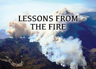 The title of this article is Lessons from the Fire. The picture is of a mountain crest forest on fire in California.