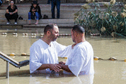 Two pilgrims make an oath during the ceremony of baptism in Israel