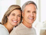 Happy smiling elderly couple at new home