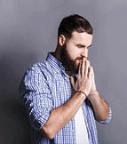 Portrait of hopeful bearded man praying.