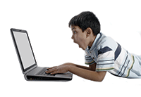 a Boy using laptop with shocked look.