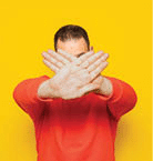 a man covering his face making a negative sign.