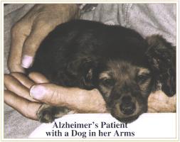 Alzheimer's Patient with a Dog in her Arms