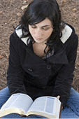 Young woman reading her Bible