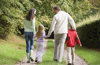 A family walking on a country path
