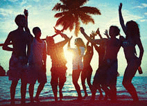 Silhouettes of a multi-ethnic group of people partying on a beach.